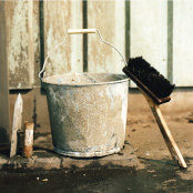 Plaster brush and zinc bucket used at building sites